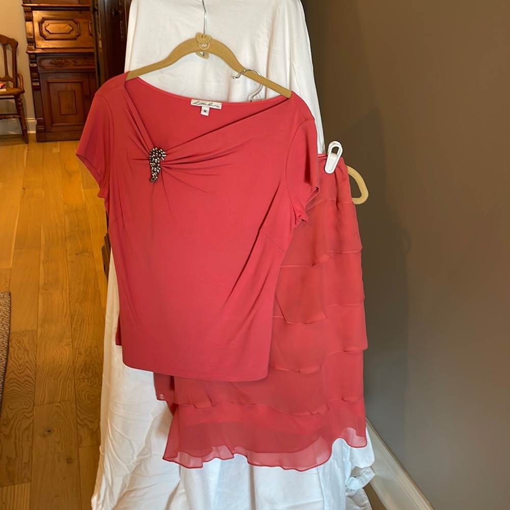 Lightweight and comfortable, 2 piece ruffled skirt and knit top.
